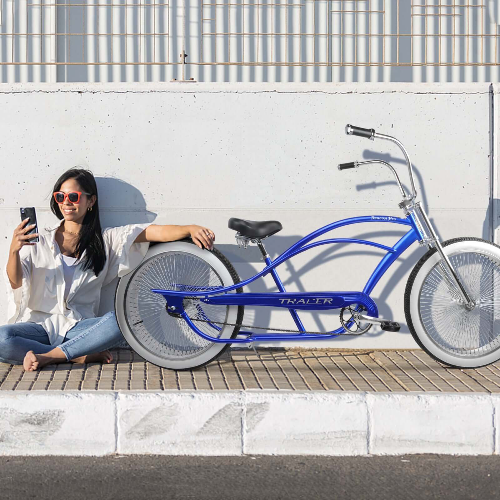Cyclist outside with Tracer Beacon Pro 140H Stretch Cruiser Bike.