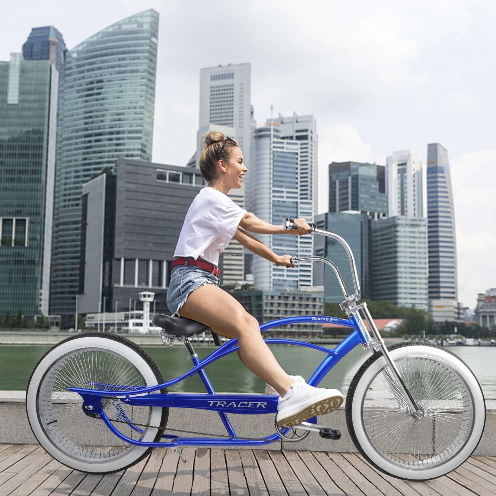 Cyclist riding the Tracer Beacon Pro 140H Stretch Beach Cruiser Bike.