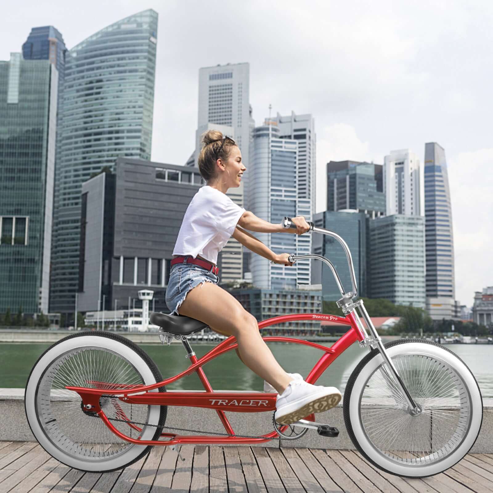 Riding Tracer Beacon Pro 140H Stretch Cruiser Bike in downtown area.