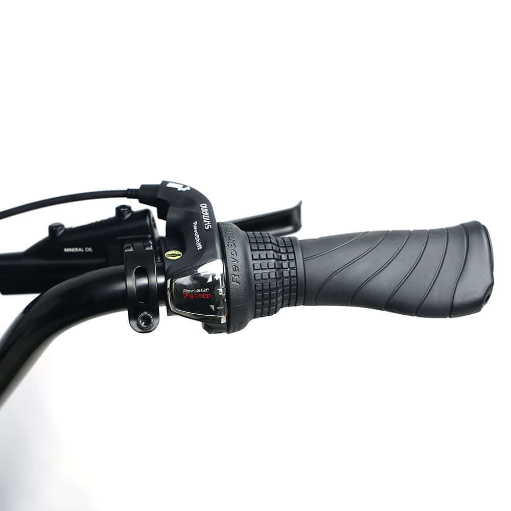 Close-up of Tracer Verge electric fat bike handlebar with gear shifter and grip.